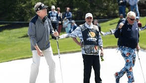 Michael Allen holes a long putt during the second round of the PGA Tour Champions Bass Pro Shops Legends of Golf tournament in Ridgevale, Mo., as partner John Daly approves.